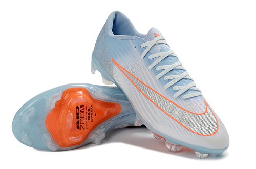Nike Mercurial Vapor 16 Elite FG en color azul glaciar con detalles en naranja.