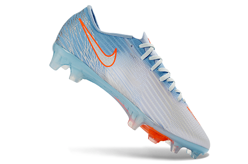 Nike Mercurial Vapor 16 Elite FG en color azul glaciar con detalles en naranja.